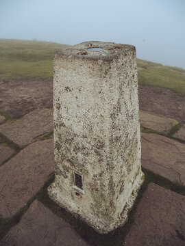 A trig point on the top of a peak in the Peak District, Cheshire