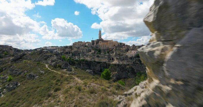 Flying Towards Sassi di Matera With Matera Cathedral In View. Basilicata, Italy. drone approach