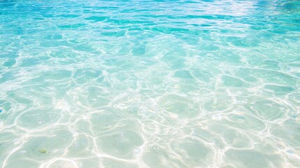 Turquoise water sparkles under the bright sun, inviting moments of calm and tranquility perfect for enjoying natureвЂ™s beauty