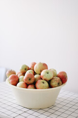 hello autumn card with fresh red apples on white background top view