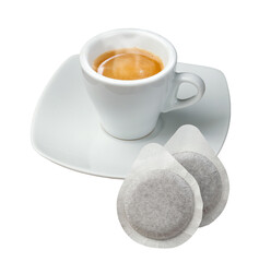 Steaming cup of coffee with pods on white background