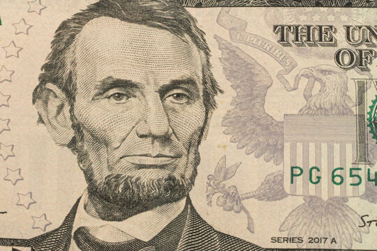 Macro shot of 5 US dollars banknote made in 2003. Abe Linkoln portrait