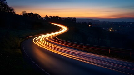 Glowing Trails of Vehicles Winding Through the Countryside at Dusk