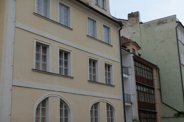 There is a very large building that features an abundance of windows situated on its exterior, providing a bright and airy atmosphere inside