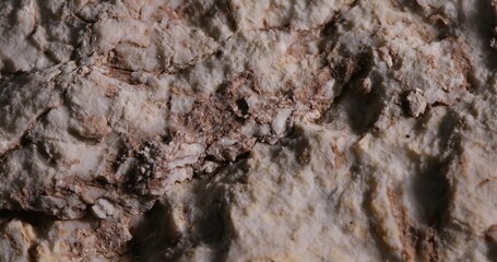Close-Up of a Rough Stone Texture with Weathering Marks