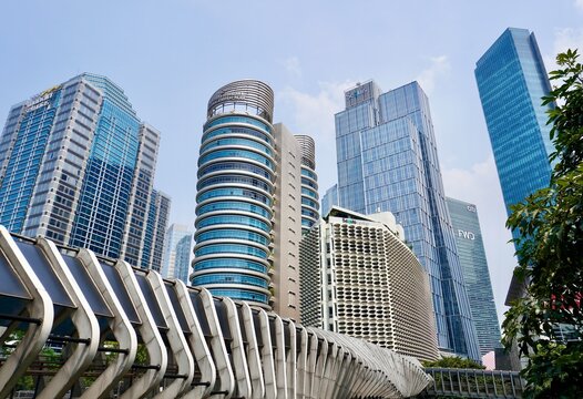 Jakarta, Indonesia - October 16th, 2024 - Tall office buildings in senayan street area in front of pedestrian crossing bridge isolated on horizontal ratio cityscape background.