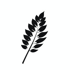 Fototapeta premium A black silhouette of a branch with several leaves