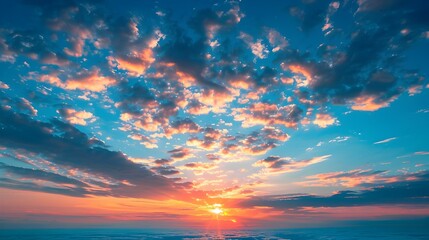 Breathtaking Sunset Sky with Vibrant Clouds and Radiant Glow over Serene Landscape