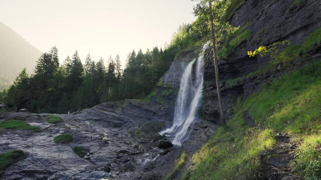 Cascade du Rouget waterfall flowing in the forest during the morning at Sixt fer a cheval, France