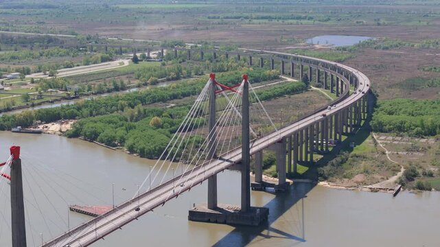 Drone view of Justo Jose de urquiza bridge above the wide Parana Guazu river, a vast waterway, Buenos Aires Argentina. Descending