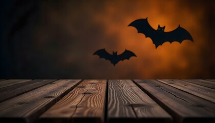 Product placement wooden table, blurred halloween bats background with copy space