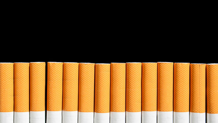 Cigarettes on the black background with copy space. Smoking cessation and quitting concept. World no tobacco day.