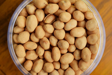 Closeup photo of Dried atomic beans in food storage or jar on wooden table