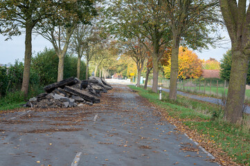 Road construction in Germany. Crushed concrete blocks of the old street on a country road.