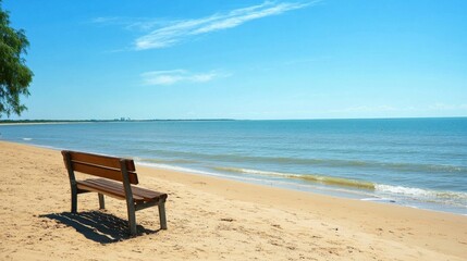Bench by the sea on a tranquil beach, no one in sight, with soft waves and a calm horizon creating a peaceful atmosphere.