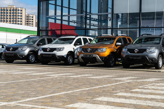 Parking lot in front of Renault service center building. New Renault cars of various colors. Close-up. Renault dealership in Mega Adygea. Krasnodar, Russia - November 01, 2022