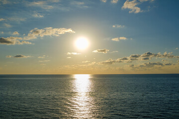 Romantic colorful sunset at the sea. View of Beautiful glorious golden sunset and golden hour above the sea in evening.