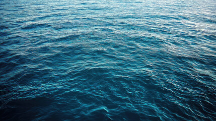 image showcases serene view of crystal blue water, with gentle waves creating calming texture. subtle splashes enhance tranquil atmosphere