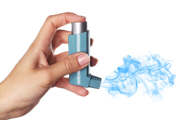 Asthma treatment. Woman holding inhaler on white background, closeup. Aerosolized medication coming...