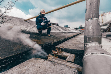 Male worker inspection visual pipeline oil and gas corrosion rust through socket tube steam gas...