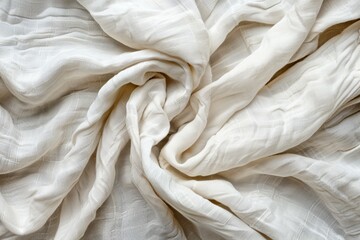 A sheet of natural linen forming an elegant spiral as a backdrop, wrinkled organic material in beige or white color