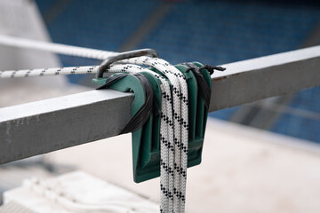 Secure green rope access equipment hangs on a metal beam for work at height, ensuring safety for technicians in industrial construction settings