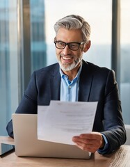 Happy busy older professional businessman entrepreneur using laptop holding bill corporate document in office 