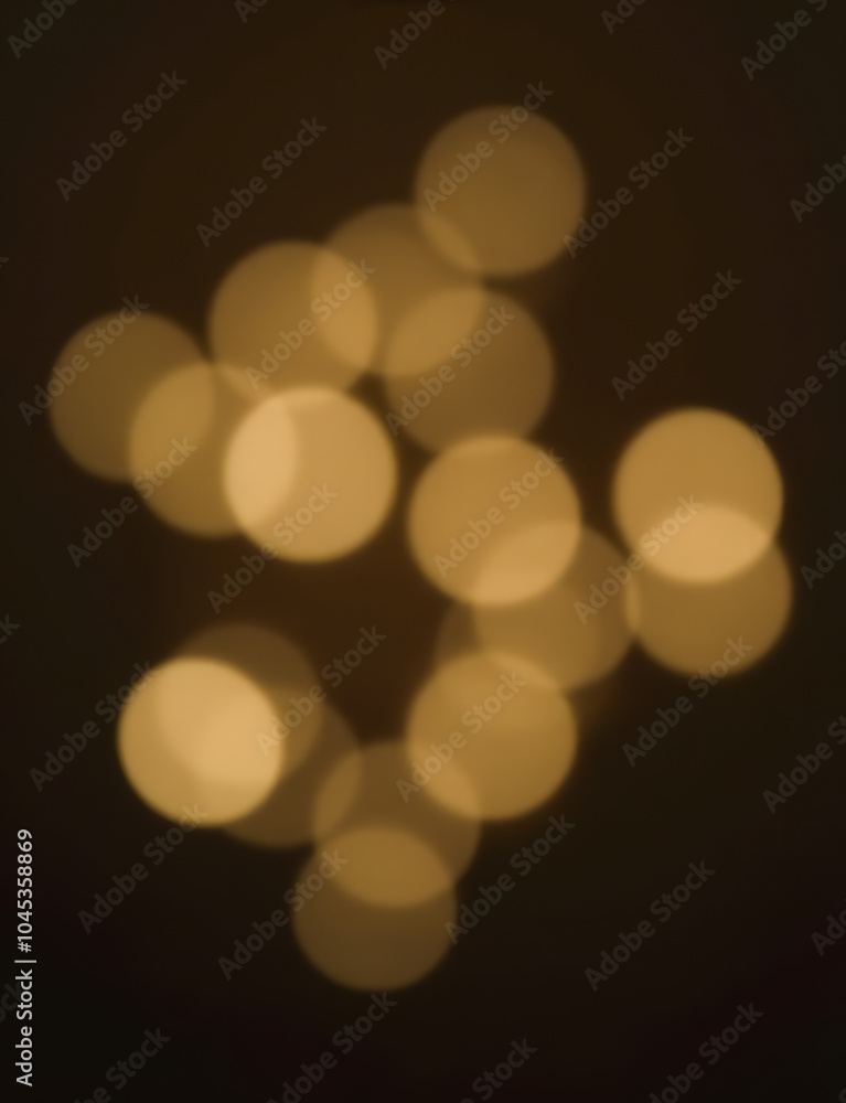 Aufkleber Faded Christmas lights create a beautiful blurred background effect with a soft, rounded shape resembling the bokeh of a camera lens.