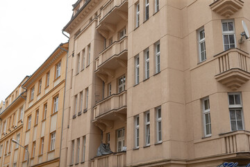 A remarkably designed building featuring numerous windows and balconies that enhance its overall aesthetic appeal and functionality