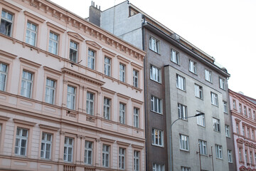 Fototapeta premium A long row of buildings featuring numerous windows adorning their exteriors, enhancing the urban landscape and architectural appeal