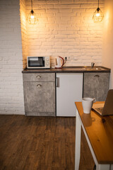 Tiny appartment. Urban Interior of comfortable modern kitchen. Scandinavian style.
