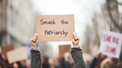 Hands Holding Smash the Patriarchy Sign at Women's Protest