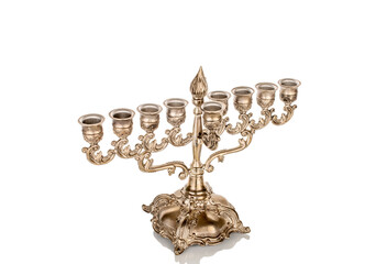 Menorah, metal golden seven-barrel lamp, or seven-candlestick, macro, isolated on white background.