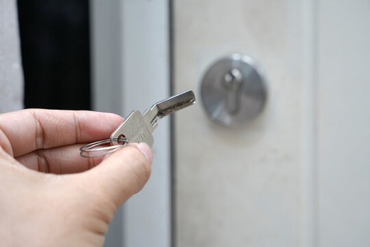bent key or broken key with background of keyhole in the door.