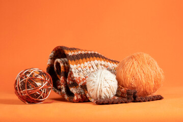Balls of wool yarn of different colors in close-up.