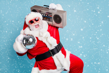 Portrait of his he nice cool fat cheerful cheery glad excited ecstatic overjoyed crazy carefree bearded Santa carrying tape player dancing having fun isolated on blue turquoise pastel color background