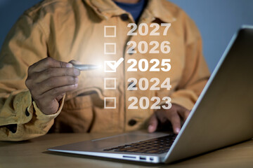 Businessman checkmark 2025 year plans event planning