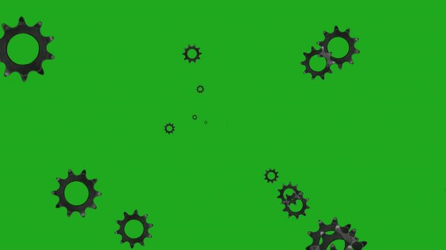 Spinning of spur gears with different sizes on green screen background