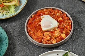 Shakshuka with Poached Egg and Salad