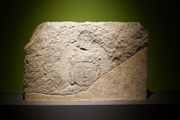 Ancient Asian stone sculpture showcasing intricate carvings and historical significance