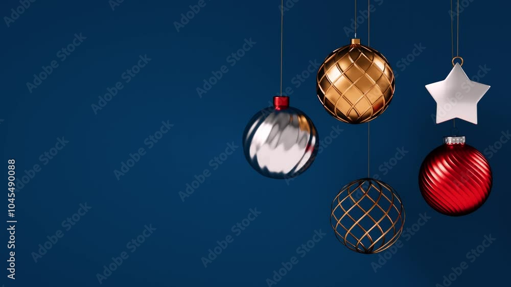 Poster video loop of festive christmas ornaments, such as tree balls, hanging on a dark blue background and