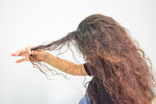 woman with long hair and damaged hair problems