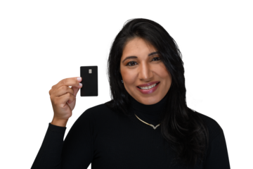 beautiful brunette woman holding a black credit card, brunette woman smiles