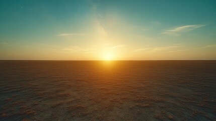 Fototapeta premium A scenic sunset over a flat, barren landscape. The sun is setting on the horizon, casting a warm glow over the land.