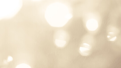 Bright golden bokeh lights create a festive and sparkling holiday ambiance