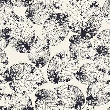 Seamless pattern with monochrome tree leaves stamps. Nature black and white grunge background. Floral inky repeat design.