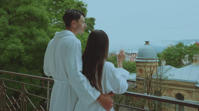 A couple with coffee on the balcony, a lover in separate robes on the balcony, lovers in the hotel drinking coffee
