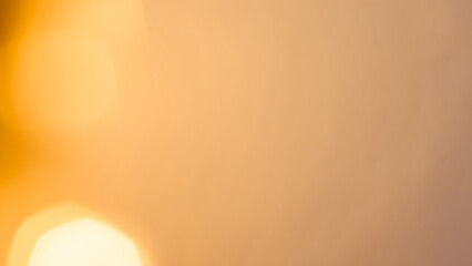 Bright golden bokeh lights create a vibrant and festive holiday background