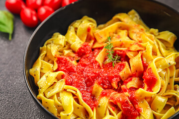 Tagliatelle pasta tomato sauce tasty food dish fresh gourmet food background on the table rustic food top view copy space