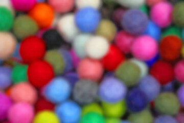 intentionally out of focus background of many wool balls